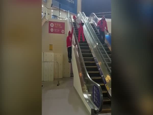 Winter Olympics Skier's Unusual Way Of Using An Escalator