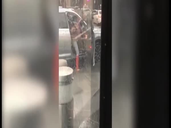 Woman Battles Against Wind During Storm Emma To Close Her Car Door
