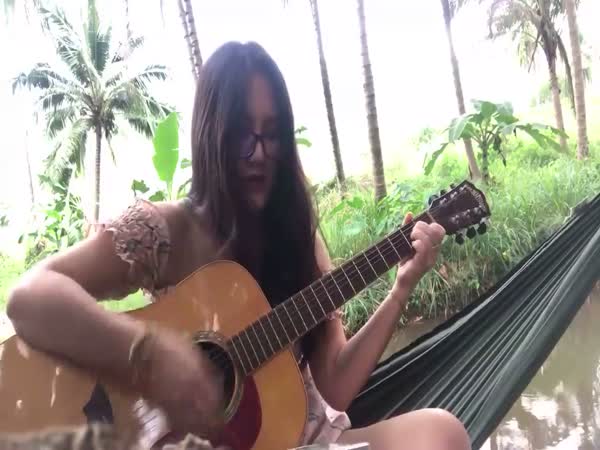 Girl Playing Guitar Breaks a String