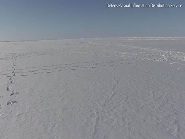 U.S. Naval Submarine Smashes Through The Ice In The Arctic Ocean