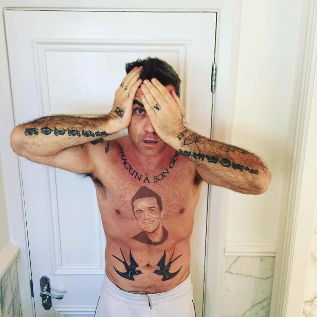 Robbie Williams Has Tattoo Of His Own Face On His Torso (2 pics)