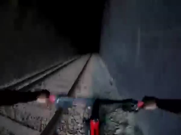 Cyclists Ride Into Railway Tunnel and Meet Train