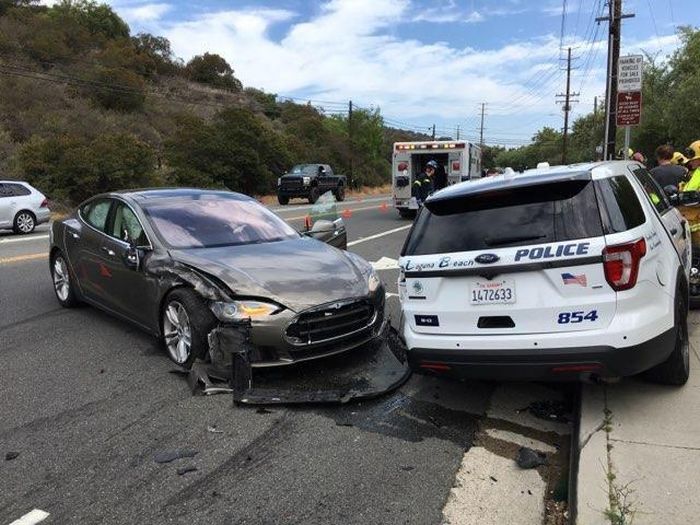 Tesla Autopilot Smashed Parked California Police Ford (3 pics)