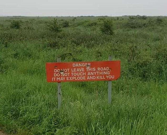 'Deadly manure gases possible!' Tourists share the VERY alarming road signs they've spotted around the world (and they might be enough to put you off your next adventure) (10 pics)