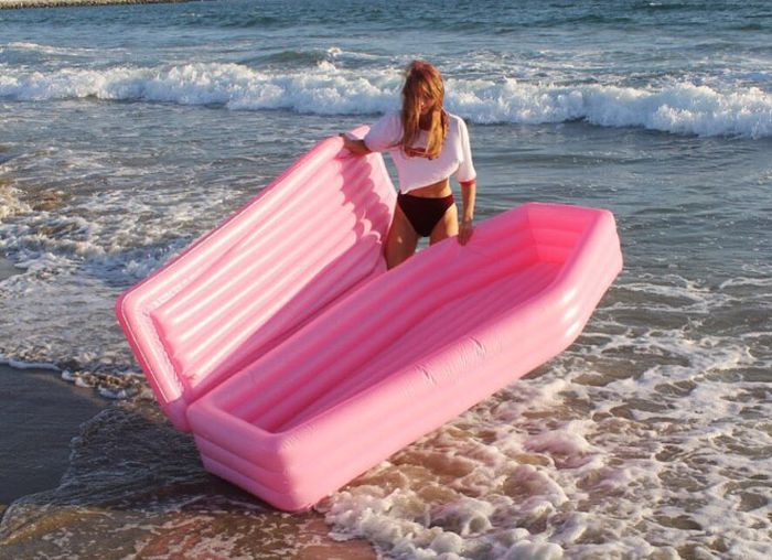 A Pink Coffin Pool Float With Lid (8 pics)