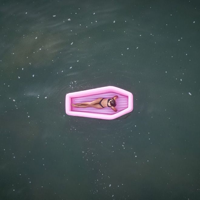 A Pink Coffin Pool Float With Lid (8 pics)