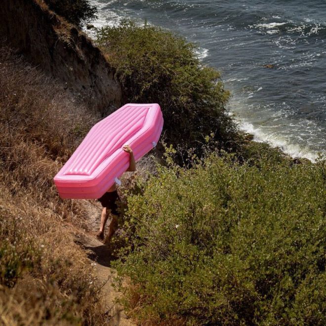 A Pink Coffin Pool Float With Lid (8 pics)