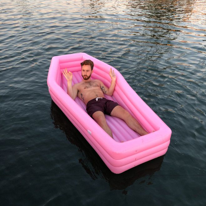 A Pink Coffin Pool Float With Lid (8 pics)