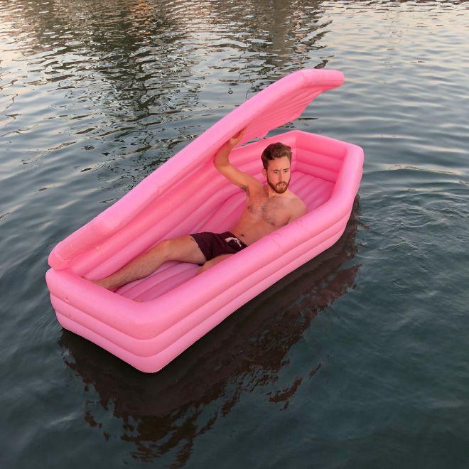 A Pink Coffin Pool Float With Lid (8 pics)