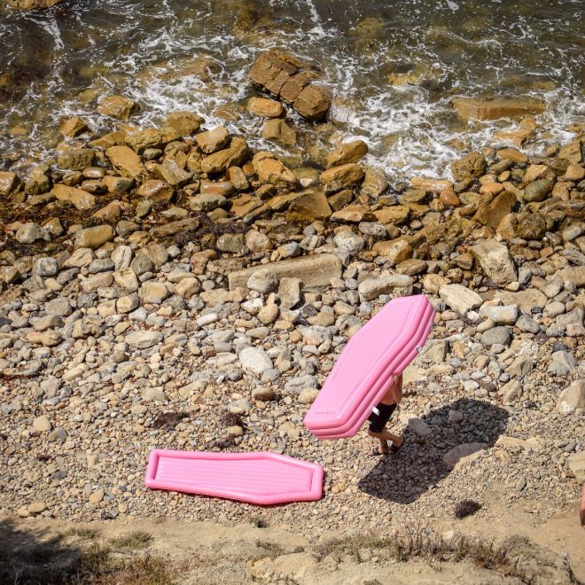 A Pink Coffin Pool Float With Lid (8 pics)