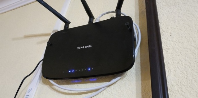 How NOT To Attach A Router To The Wall (3 pics)