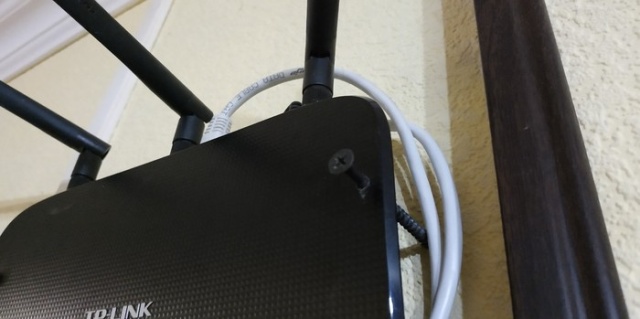 How NOT To Attach A Router To The Wall (3 pics)