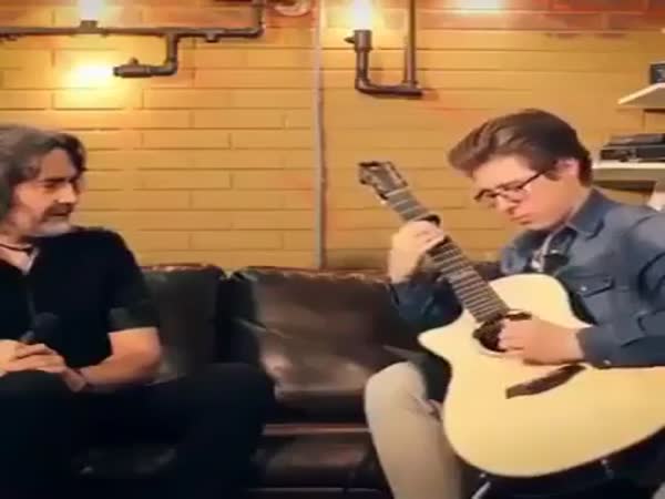 Guy Tuning The Guitar While Playing It