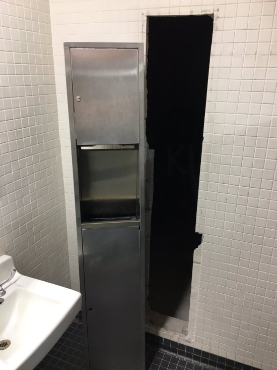 Danny DeVito Shrine Hidden Behind The Paper Towel Dispenser In One Of The School Bathrooms (4 pics)