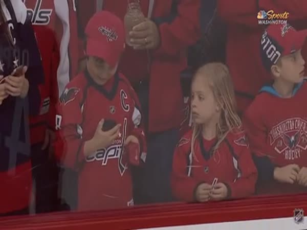 Hockey Player Tries To Give A Puck To A Young Girl