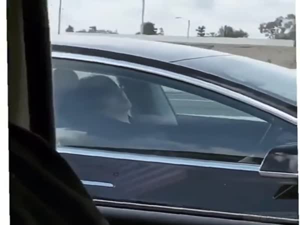 Guy Sleeping In His Tesla