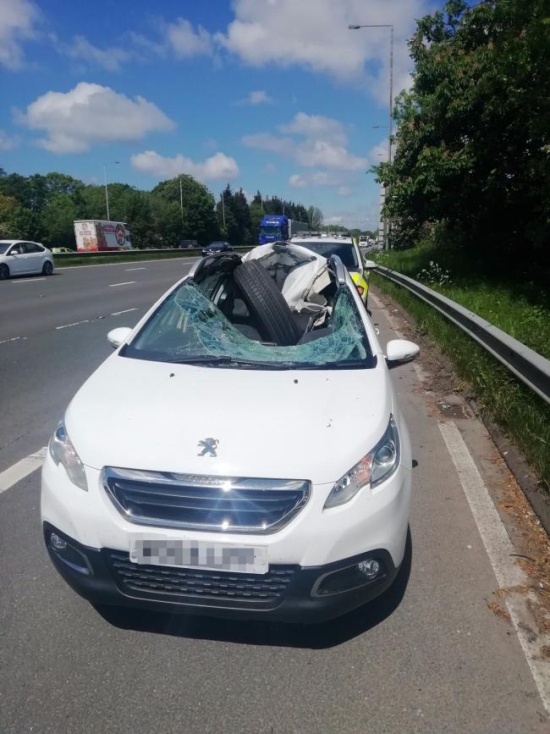 A HGV Wheel Smashes Through A Car Windscreen. The Driver Walks Away (4 pics)