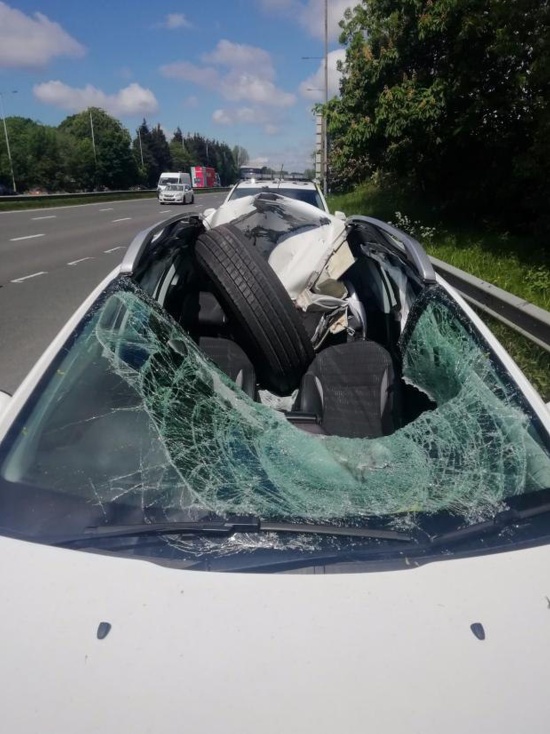 A HGV Wheel Smashes Through A Car Windscreen. The Driver Walks Away (4 pics)