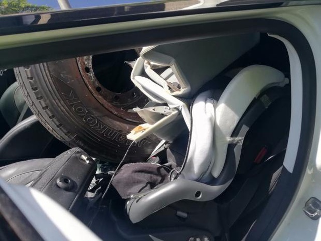 A HGV Wheel Smashes Through A Car Windscreen. The Driver Walks Away (4 pics)