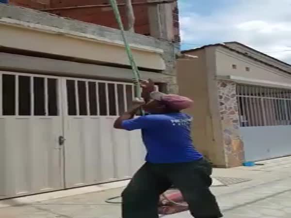 Lifting A Bag Of Cement With A Rope