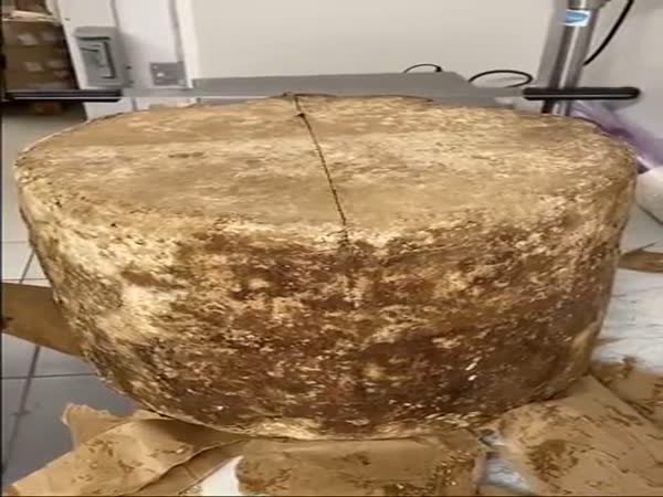 Opening A Huge Cheese Wheel With A Wire Cutter