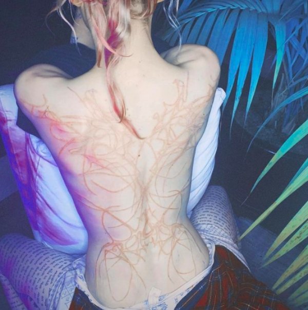 Internet Is Roasting Singer Grimes For 'Alien Scars' Tattoo (19 pics) Internet Is Roasting Singer Grimes For 'Alien Scars' Tattoo (19 pics)