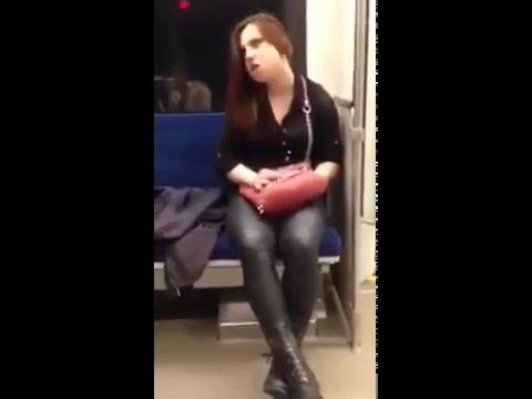 Crazy Woman Attacks Pedestrian On Train?!?
